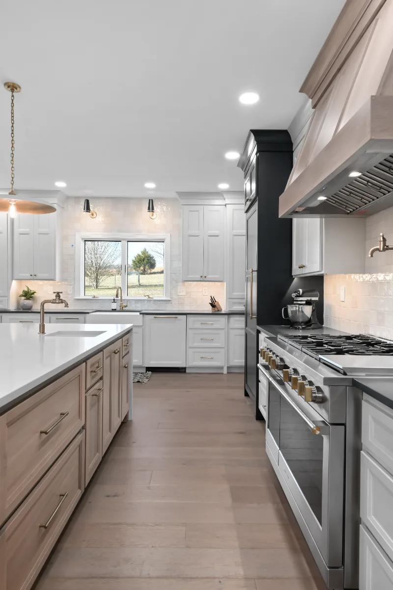Kitchen remodel in Columbia, TN. Sebring Design Build transformed this Columbia, Tennessee kitchen with a transitional-bold design: perimeter cabinetry in Paint Grade Stone, tall cabinets in Bunker Hill Black.