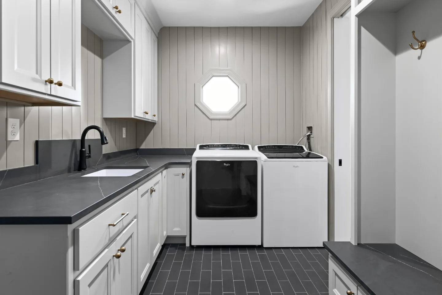 Laundry remodel in Columbia, TN. Sebring Design Build transformed this Columbia, Tennessee laundry room from a utility space into a fully designed room with Paint Grade Stone cabinetry.
