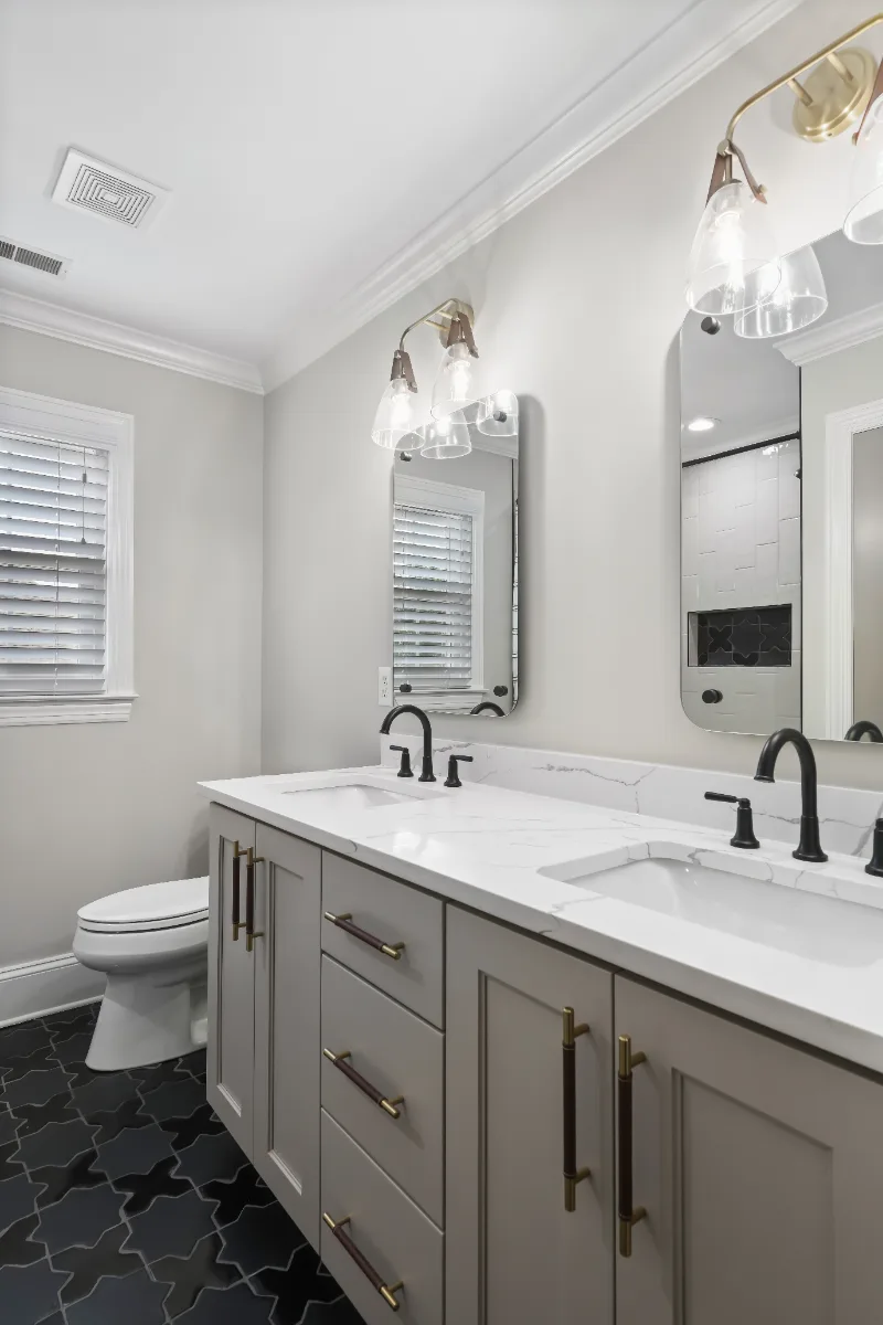 Guest Bath remodel in Watkins Creek, TN. Sebring Design Build designed this Watkins Creek guest bath (HIS) in Franklin, Tennessee with paint-grade Dune cabinetry, Mikado Calacatta Tree quartz.