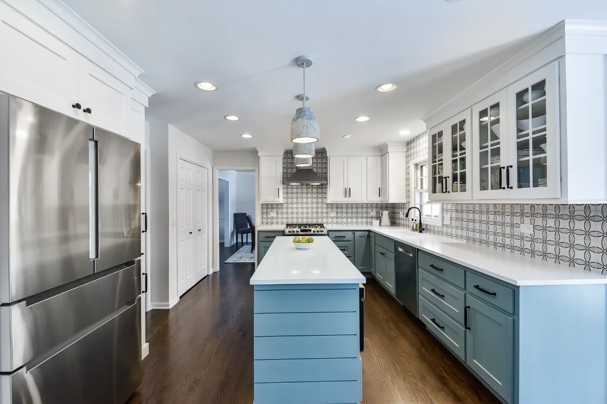Kitchen remodel in Franklin, TN. Sebring Design Build transformed this Franklin, Tennessee kitchen with CWP Craftsman Recessed Square cabinetry in Puget Sound bases and island and Soft White uppers.