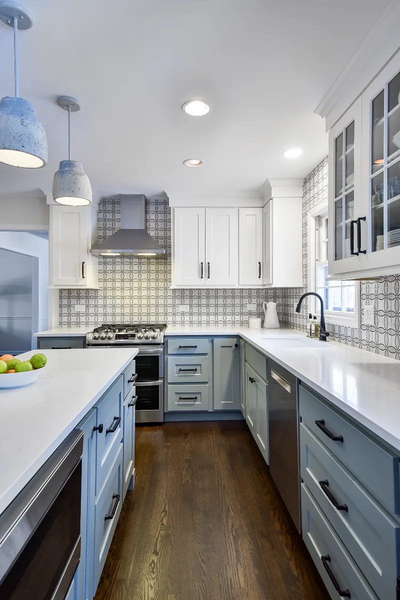 Kitchen remodel in Franklin, TN. Sebring Design Build transformed this Franklin, Tennessee kitchen with CWP Craftsman Recessed Square cabinetry in Puget Sound bases and island and Soft White uppers.