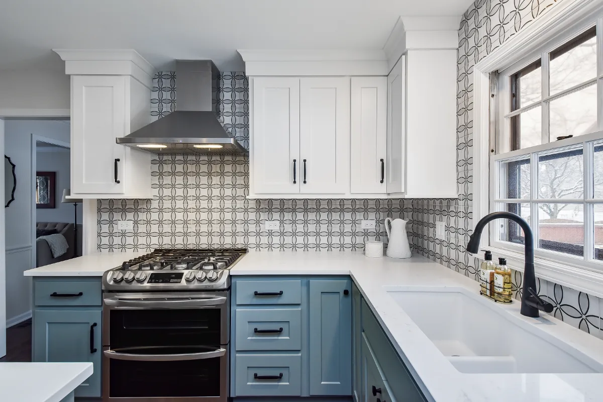 Kitchen remodel in Franklin, TN. Sebring Design Build transformed this Franklin, Tennessee kitchen with CWP Craftsman Recessed Square cabinetry in Puget Sound bases and island and Soft White uppers.