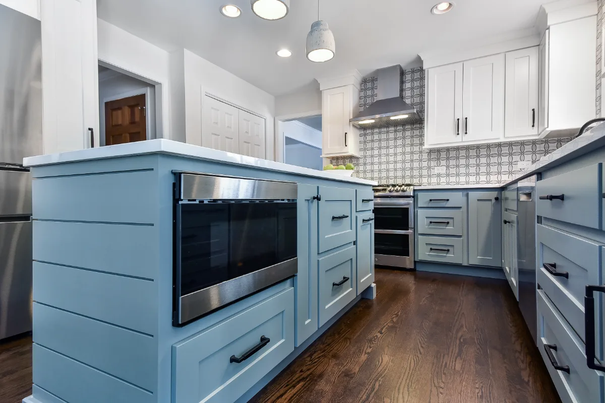 Kitchen remodel in Franklin, TN. Sebring Design Build transformed this Franklin, Tennessee kitchen with CWP Craftsman Recessed Square cabinetry in Puget Sound bases and island and Soft White uppers.