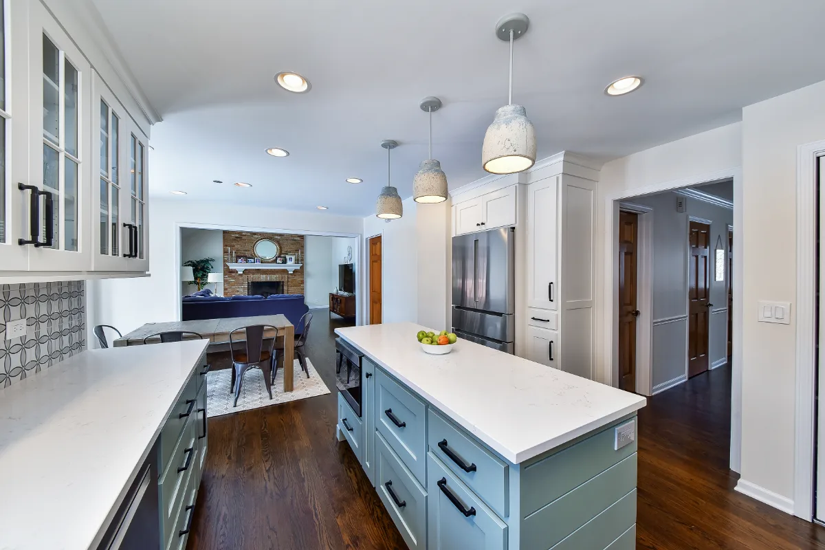 Kitchen remodel in Franklin, TN. Sebring Design Build transformed this Franklin, Tennessee kitchen with CWP Craftsman Recessed Square cabinetry in Puget Sound bases and island and Soft White uppers.