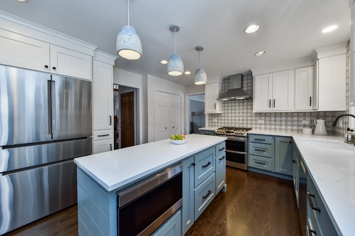Kitchen remodel in Franklin, TN. Sebring Design Build transformed this Franklin, Tennessee kitchen with CWP Craftsman Recessed Square cabinetry in Puget Sound bases and island and Soft White uppers.