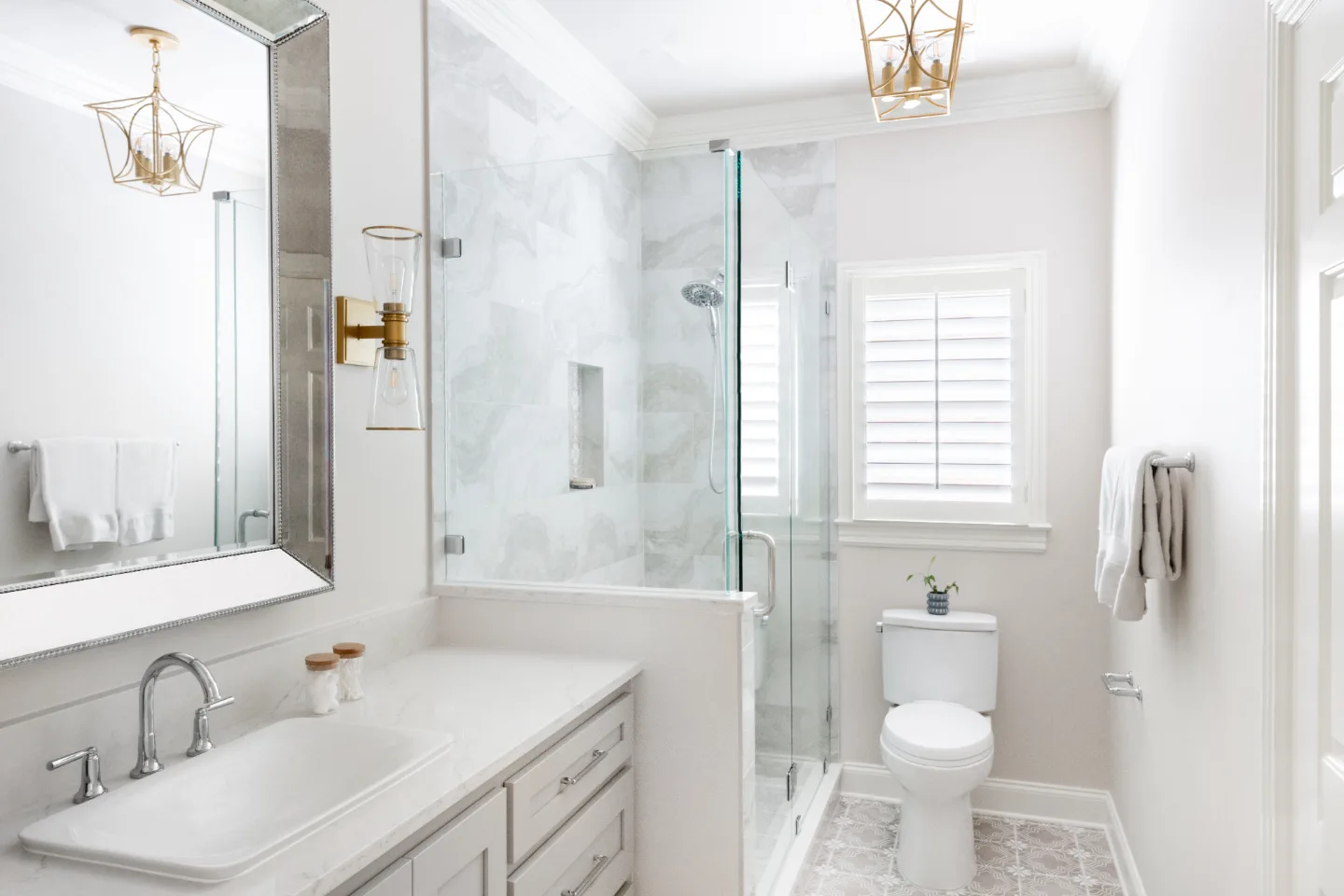 Primary Bath remodel in Cool Springs, TN. Sebring Design Build transformed this Cool Springs primary bath in Franklin, Tennessee with Shaker Recessed Square Dune cabinetry, Metro Quartz Mystique Square Edge countertops.