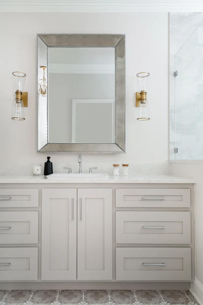 Primary Bath remodel in Cool Springs, TN. Sebring Design Build transformed this Cool Springs primary bath in Franklin, Tennessee with Shaker Recessed Square Dune cabinetry, Metro Quartz Mystique Square Edge countertops.