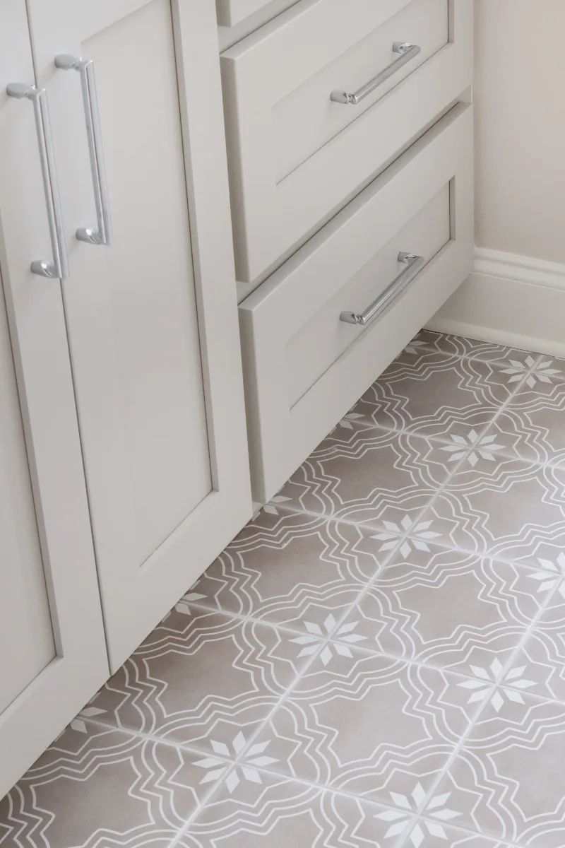 Primary Bath remodel in Cool Springs, TN. Sebring Design Build transformed this Cool Springs primary bath in Franklin, Tennessee with Shaker Recessed Square Dune cabinetry, Metro Quartz Mystique Square Edge countertops.