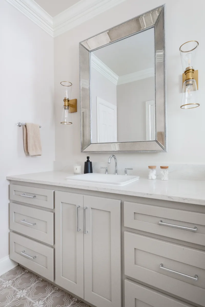 Primary Bath remodel in Cool Springs, TN. Sebring Design Build transformed this Cool Springs primary bath in Franklin, Tennessee with Shaker Recessed Square Dune cabinetry, Metro Quartz Mystique Square Edge countertops.