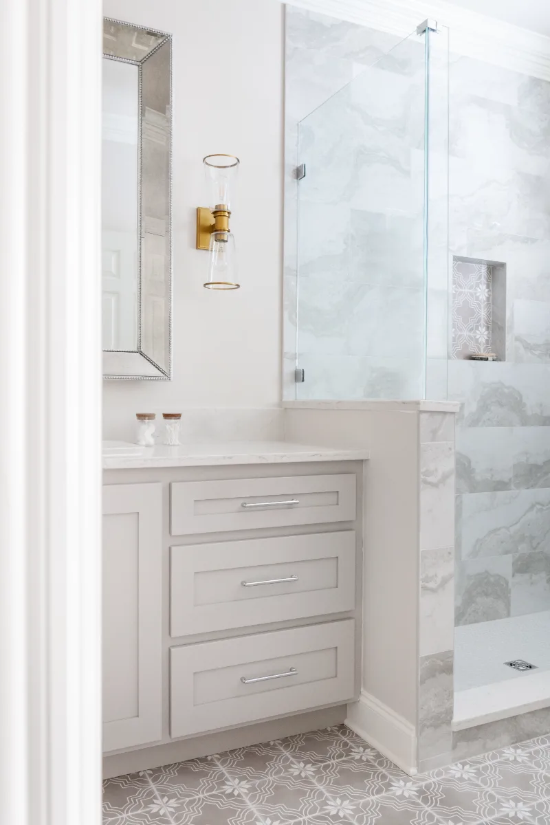 Primary Bath remodel in Cool Springs, TN. Sebring Design Build transformed this Cool Springs primary bath in Franklin, Tennessee with Shaker Recessed Square Dune cabinetry, Metro Quartz Mystique Square Edge countertops.