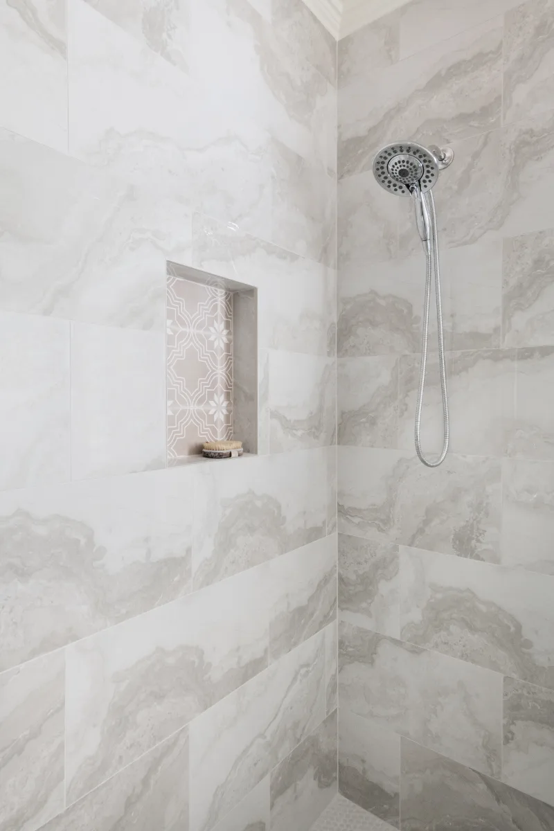 Primary Bath remodel in Cool Springs, TN. Sebring Design Build transformed this Cool Springs primary bath in Franklin, Tennessee with Shaker Recessed Square Dune cabinetry, Metro Quartz Mystique Square Edge countertops.