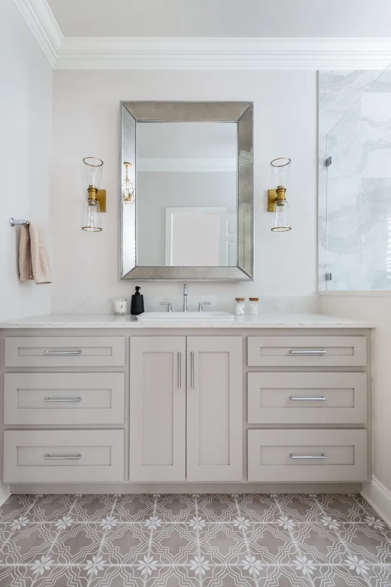 Primary Bath remodel in Cool Springs, TN. Sebring Design Build transformed this Cool Springs primary bath in Franklin, Tennessee with Shaker Recessed Square Dune cabinetry, Metro Quartz Mystique Square Edge countertops.