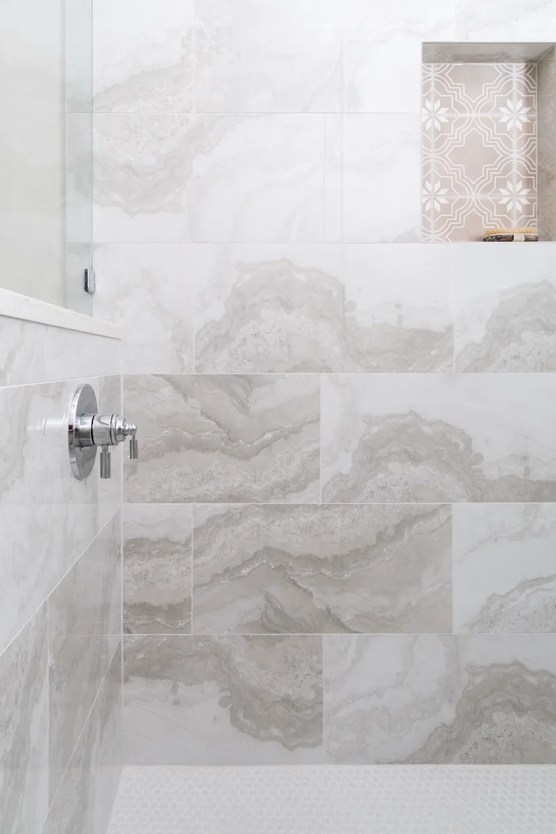 Primary Bath remodel in Cool Springs, TN. Sebring Design Build transformed this Cool Springs primary bath in Franklin, Tennessee with Shaker Recessed Square Dune cabinetry, Metro Quartz Mystique Square Edge countertops.