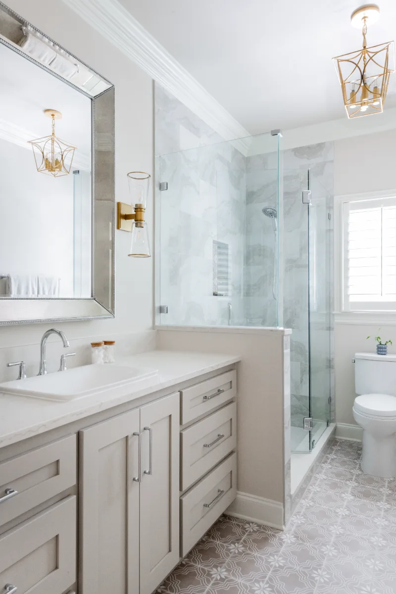 Primary Bath remodel in Cool Springs, TN. Sebring Design Build transformed this Cool Springs primary bath in Franklin, Tennessee with Shaker Recessed Square Dune cabinetry, Metro Quartz Mystique Square Edge countertops.