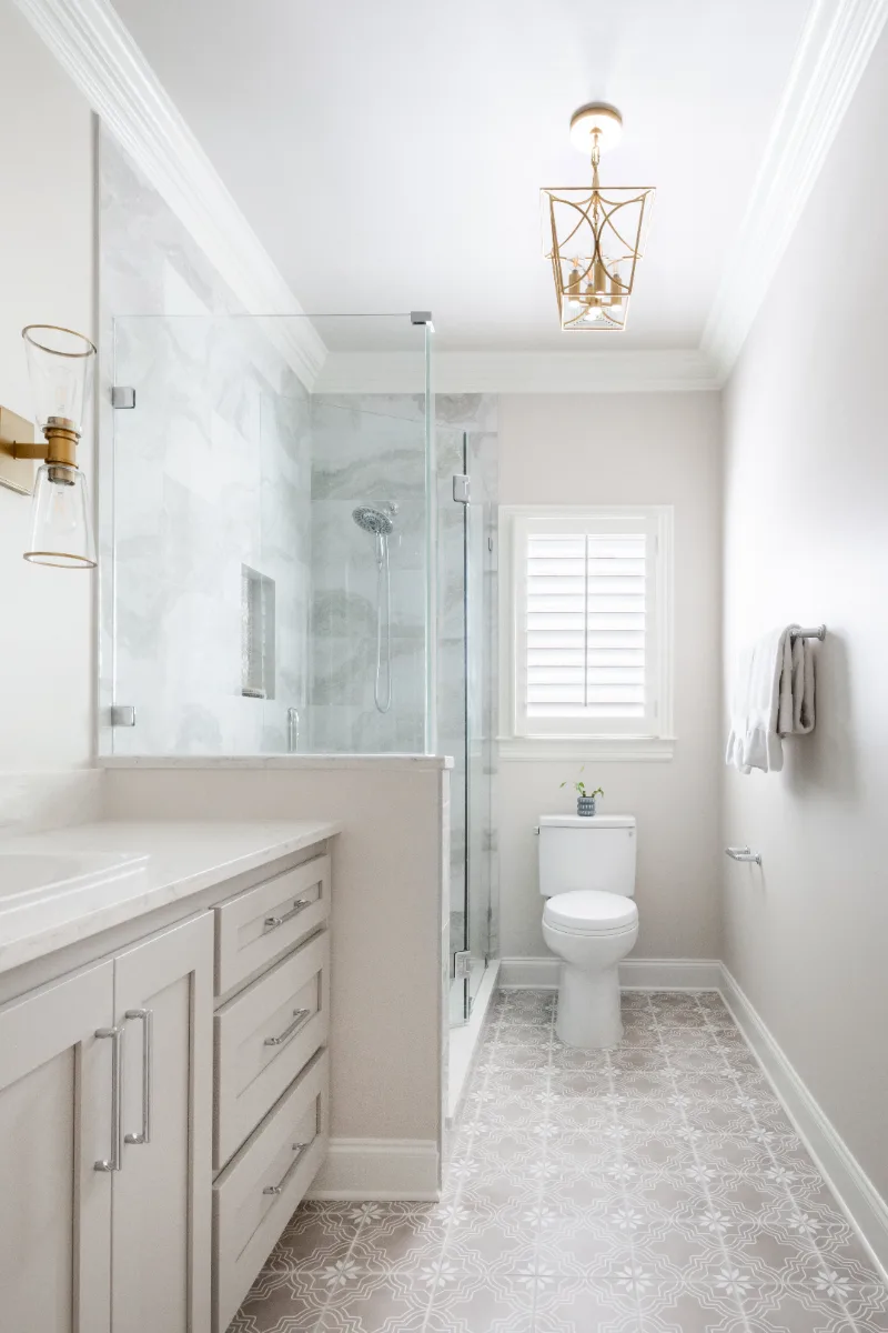 Primary Bath remodel in Cool Springs, TN. Sebring Design Build transformed this Cool Springs primary bath in Franklin, Tennessee with Shaker Recessed Square Dune cabinetry, Metro Quartz Mystique Square Edge countertops.