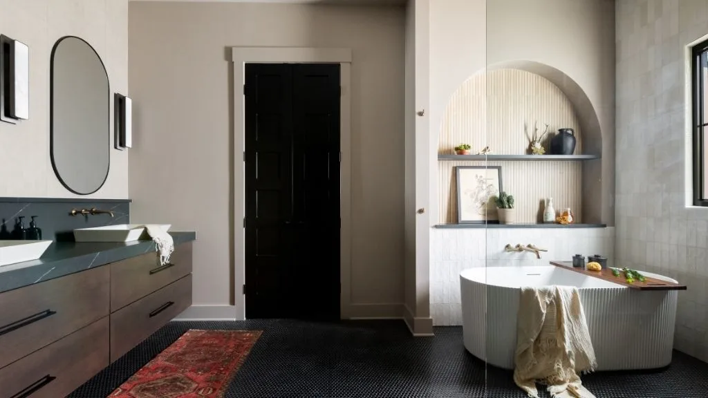 Primary Bath remodel in Columbia, TN. Sebring Design Build transformed this Columbia, Tennessee primary bath with Walnut Natural Slab cabinetry with horizontal grain in a matte finish.