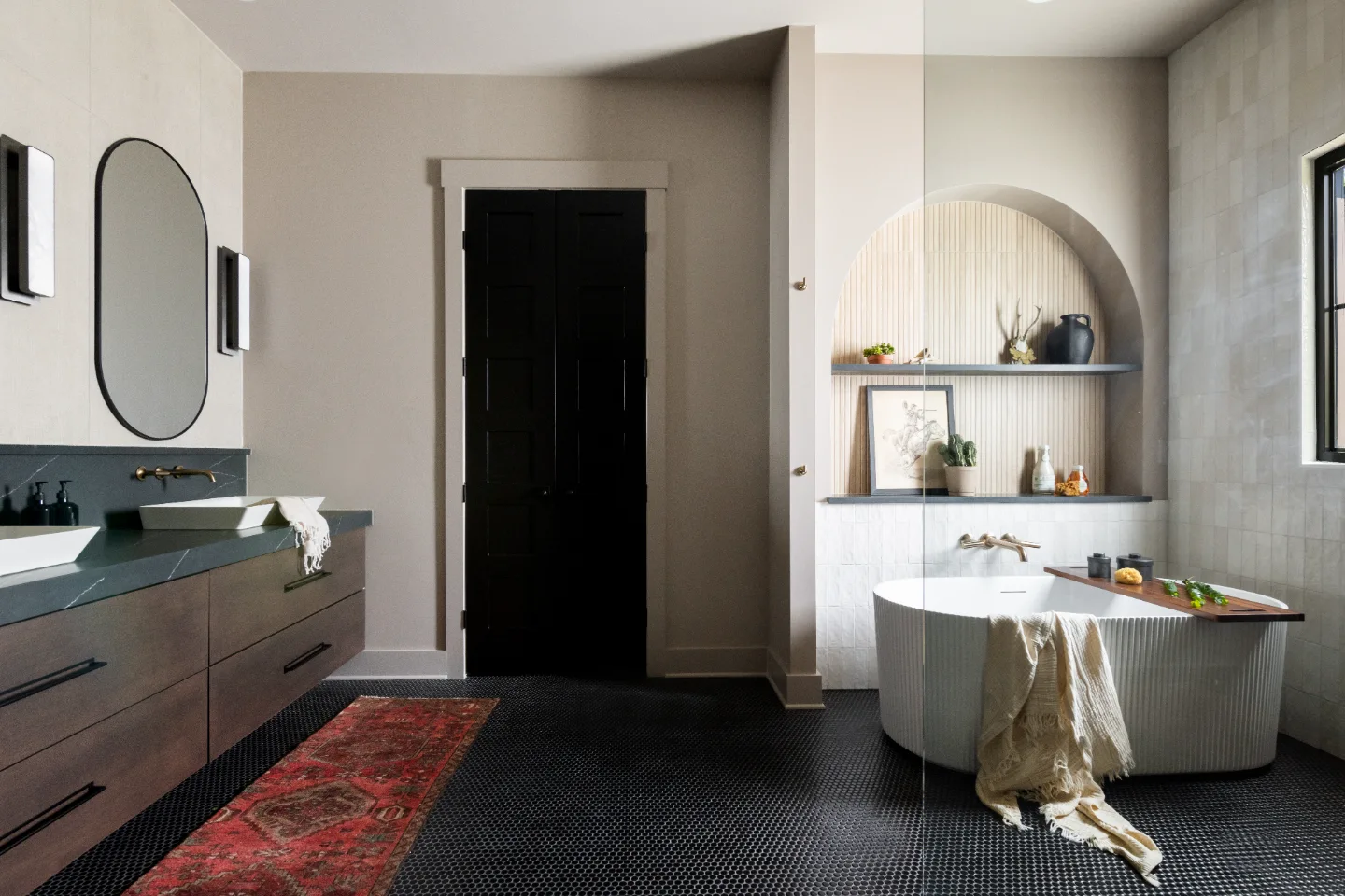 Primary Bath remodel in Columbia, TN. Sebring Design Build transformed this Columbia, Tennessee primary bath with Walnut Natural Slab cabinetry with horizontal grain in a matte finish.