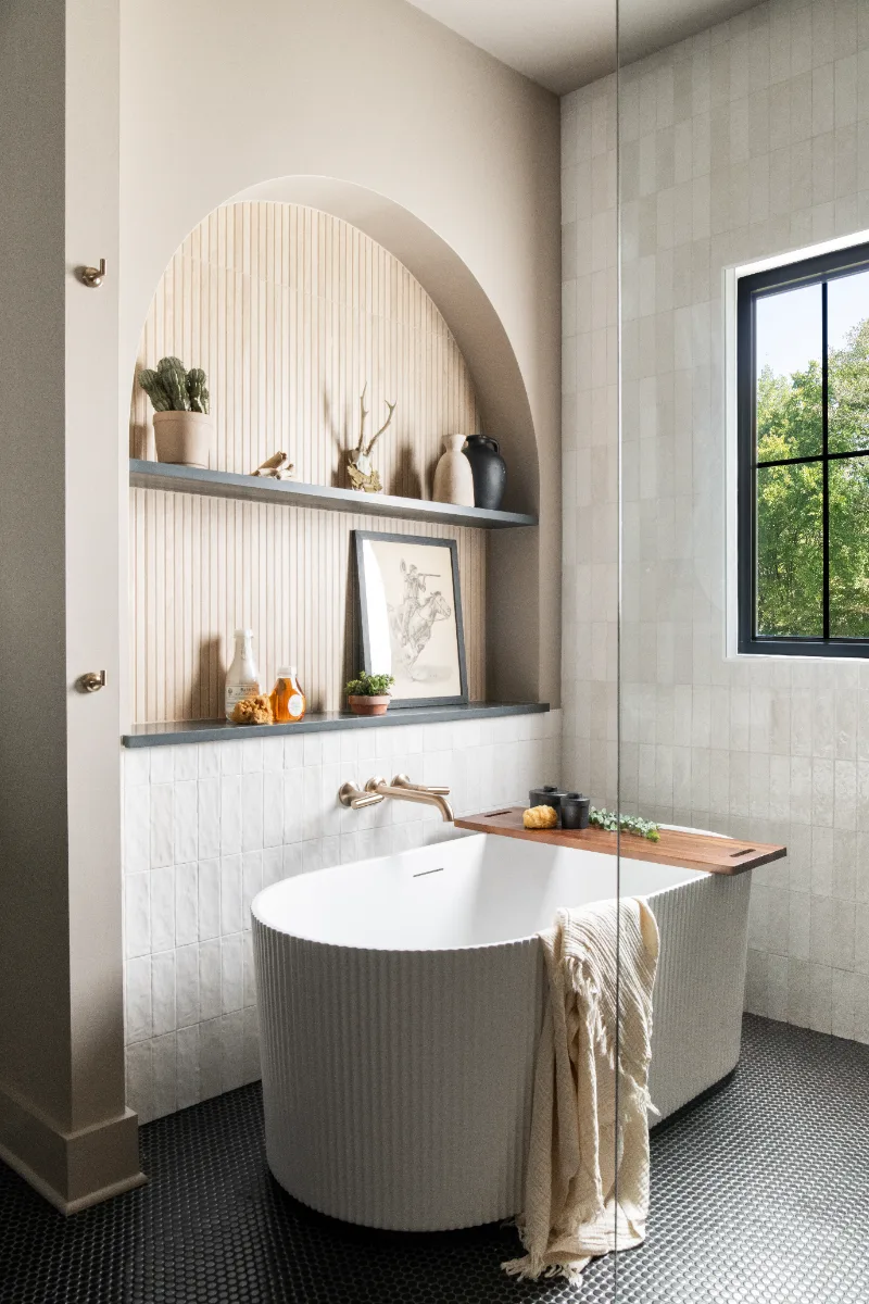 Primary Bath remodel in Columbia, TN. Sebring Design Build transformed this Columbia, Tennessee primary bath with Walnut Natural Slab cabinetry with horizontal grain in a matte finish.