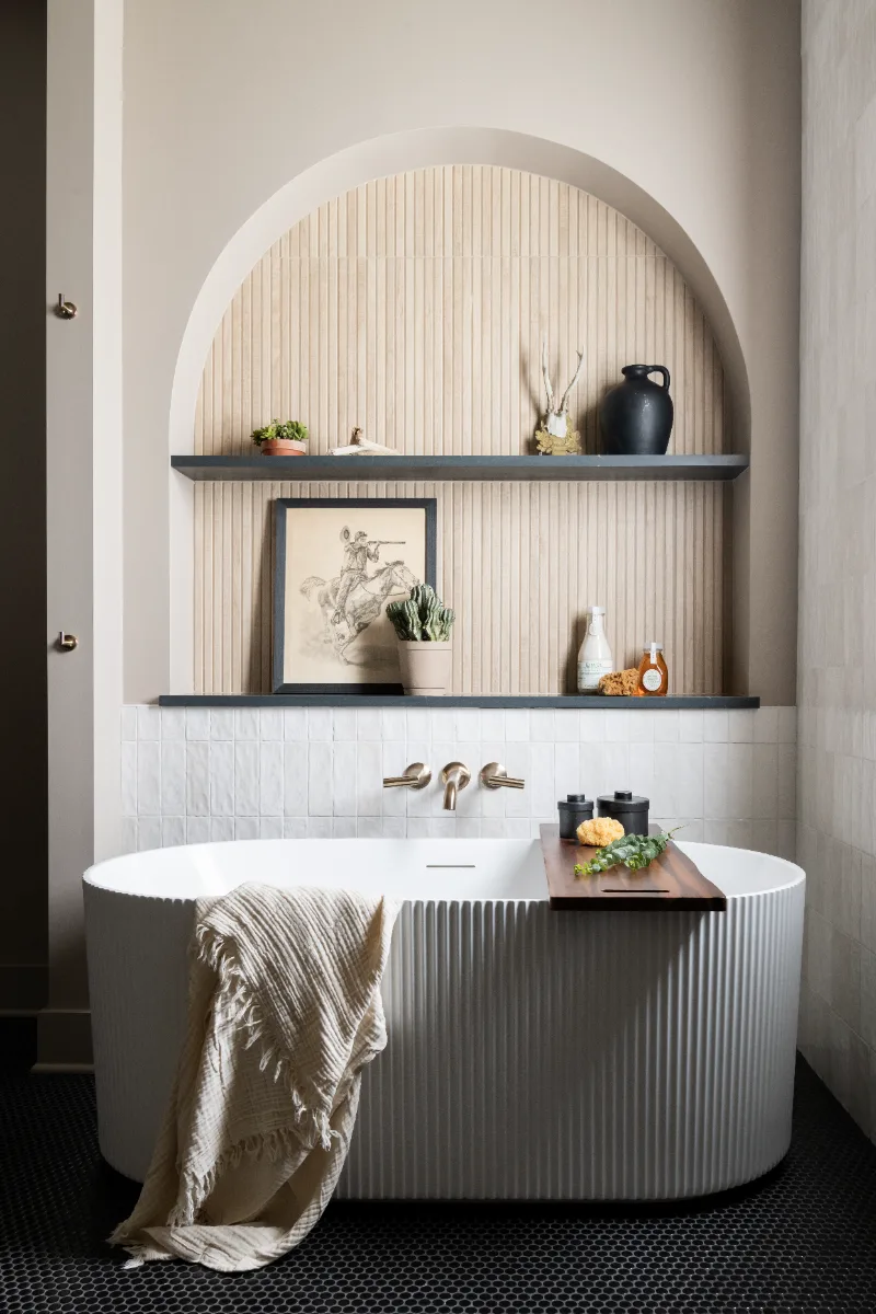 Primary Bath remodel in Columbia, TN. Sebring Design Build transformed this Columbia, Tennessee primary bath with Walnut Natural Slab cabinetry with horizontal grain in a matte finish.