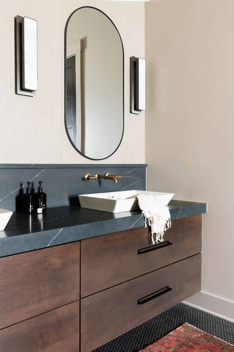 Primary Bath remodel in Columbia, TN. Sebring Design Build transformed this Columbia, Tennessee primary bath with Walnut Natural Slab cabinetry with horizontal grain in a matte finish.