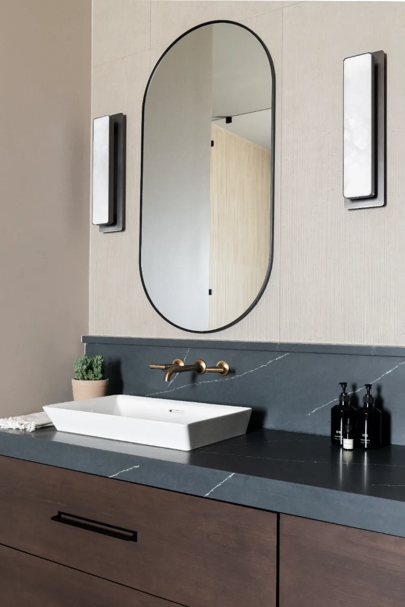Primary Bath remodel in Columbia, TN. Sebring Design Build transformed this Columbia, Tennessee primary bath with Walnut Natural Slab cabinetry with horizontal grain in a matte finish.