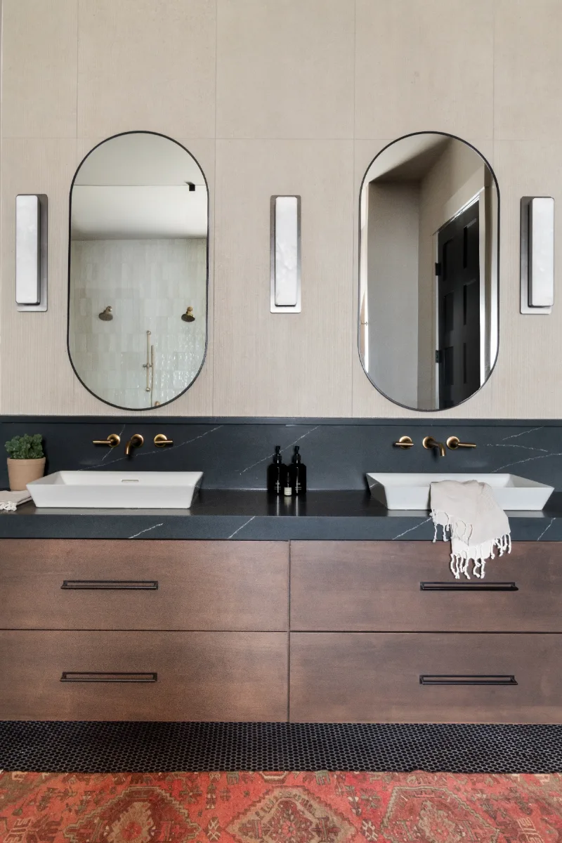 Primary Bath remodel in Columbia, TN. Sebring Design Build transformed this Columbia, Tennessee primary bath with Walnut Natural Slab cabinetry with horizontal grain in a matte finish.