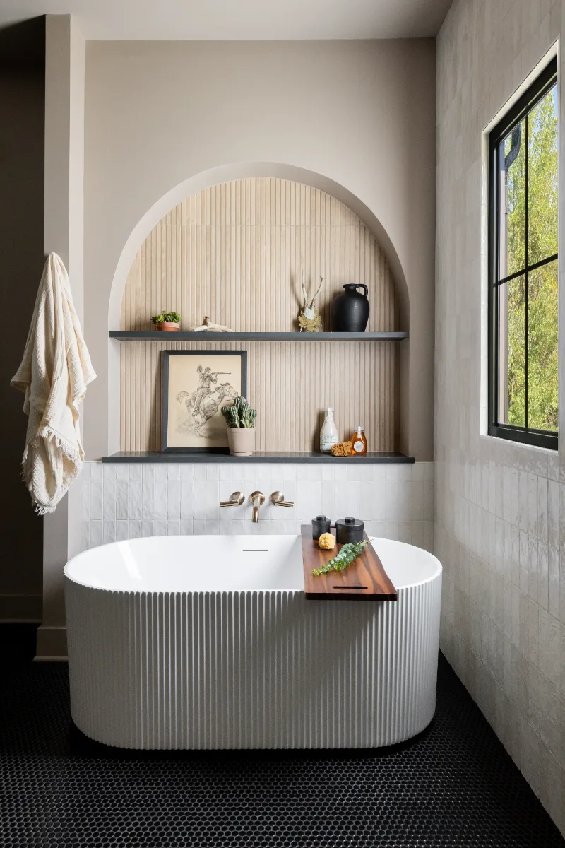 Primary Bath remodel in Columbia, TN. Sebring Design Build transformed this Columbia, Tennessee primary bath with Walnut Natural Slab cabinetry with horizontal grain in a matte finish.