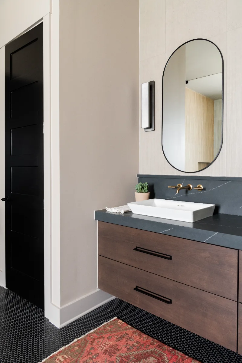 Primary Bath remodel in Columbia, TN. Sebring Design Build transformed this Columbia, Tennessee primary bath with Walnut Natural Slab cabinetry with horizontal grain in a matte finish.