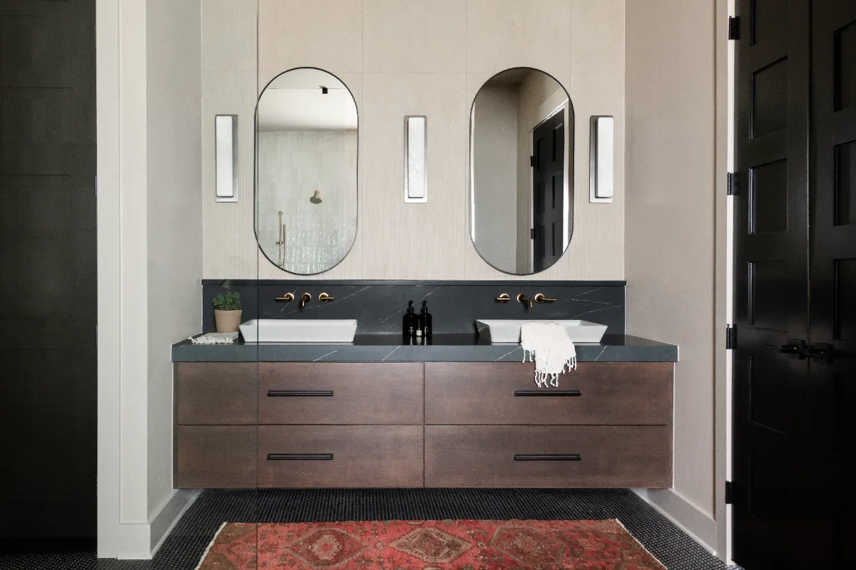 Primary Bath remodel in Columbia, TN. Sebring Design Build transformed this Columbia, Tennessee primary bath with Walnut Natural Slab cabinetry with horizontal grain in a matte finish.
