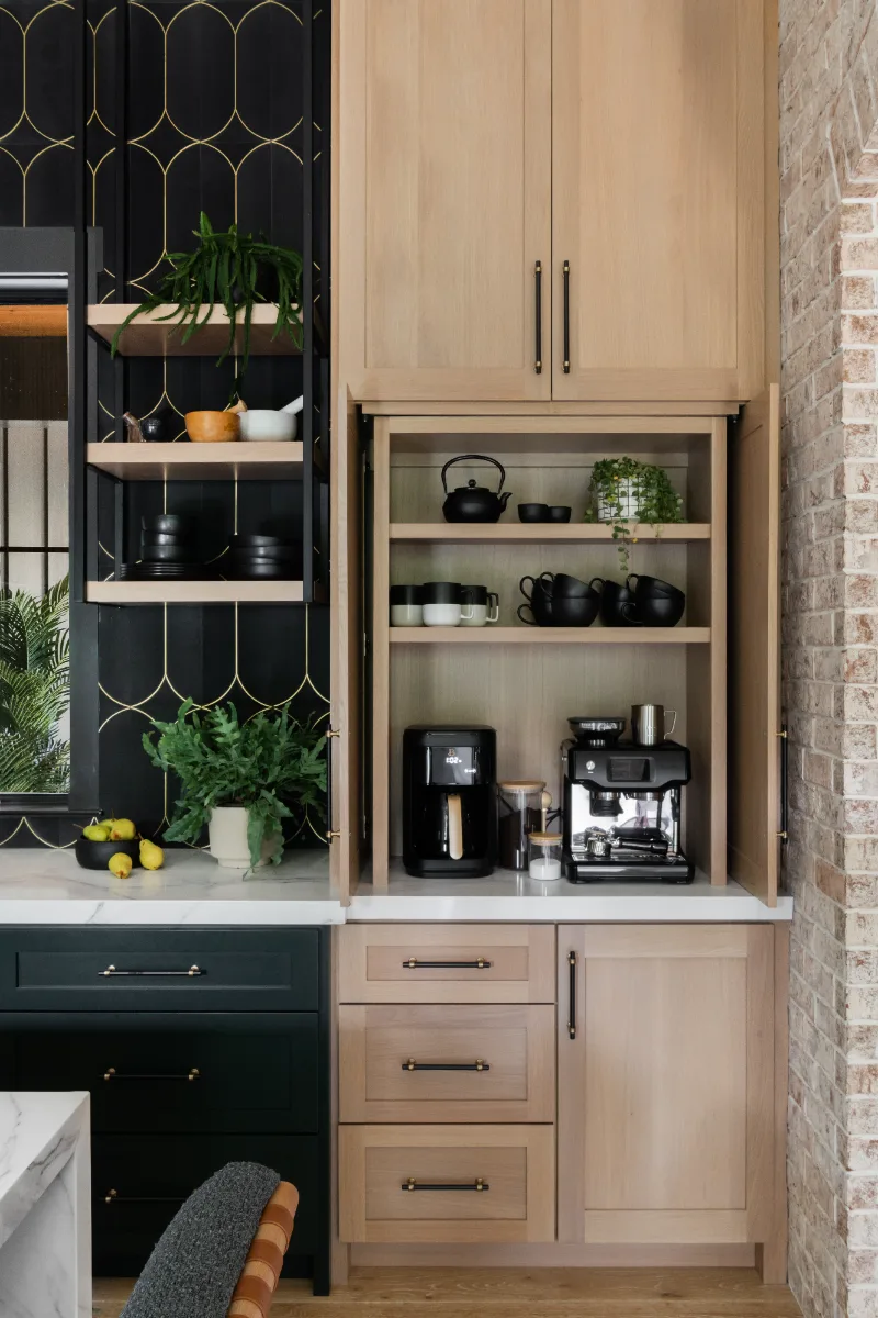 Kitchen remodel in Columbia, TN. Sebring Design Build transformed this Columbia, Tennessee kitchen with CWP Shaker Recessed cabinetry in Sherwin Williams Jasper, a White Oak Champagne Matte island and coffee bar.