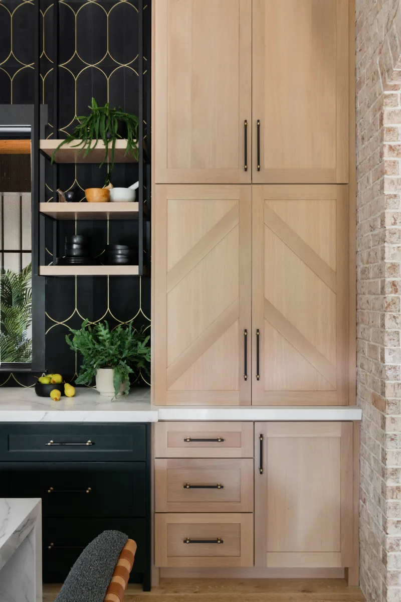 Kitchen remodel in Columbia, TN. Sebring Design Build transformed this Columbia, Tennessee kitchen with CWP Shaker Recessed cabinetry in Sherwin Williams Jasper, a White Oak Champagne Matte island and coffee bar.