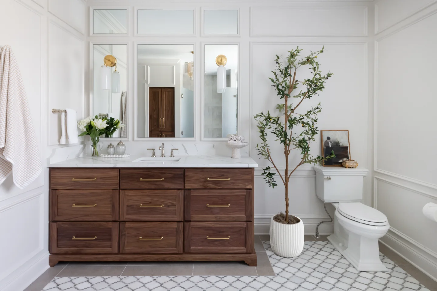 An elegant-classic primary bath remodel in Willowsprings, Franklin TN 37064. CWP Walnut Natural Solid Wood Panel cabinetry, Mikado Calacatta Gold quartz, Brizo Invari Polished Nickel, Gallery Pearl shower tile, and Empyrean Ice Blend floor by.