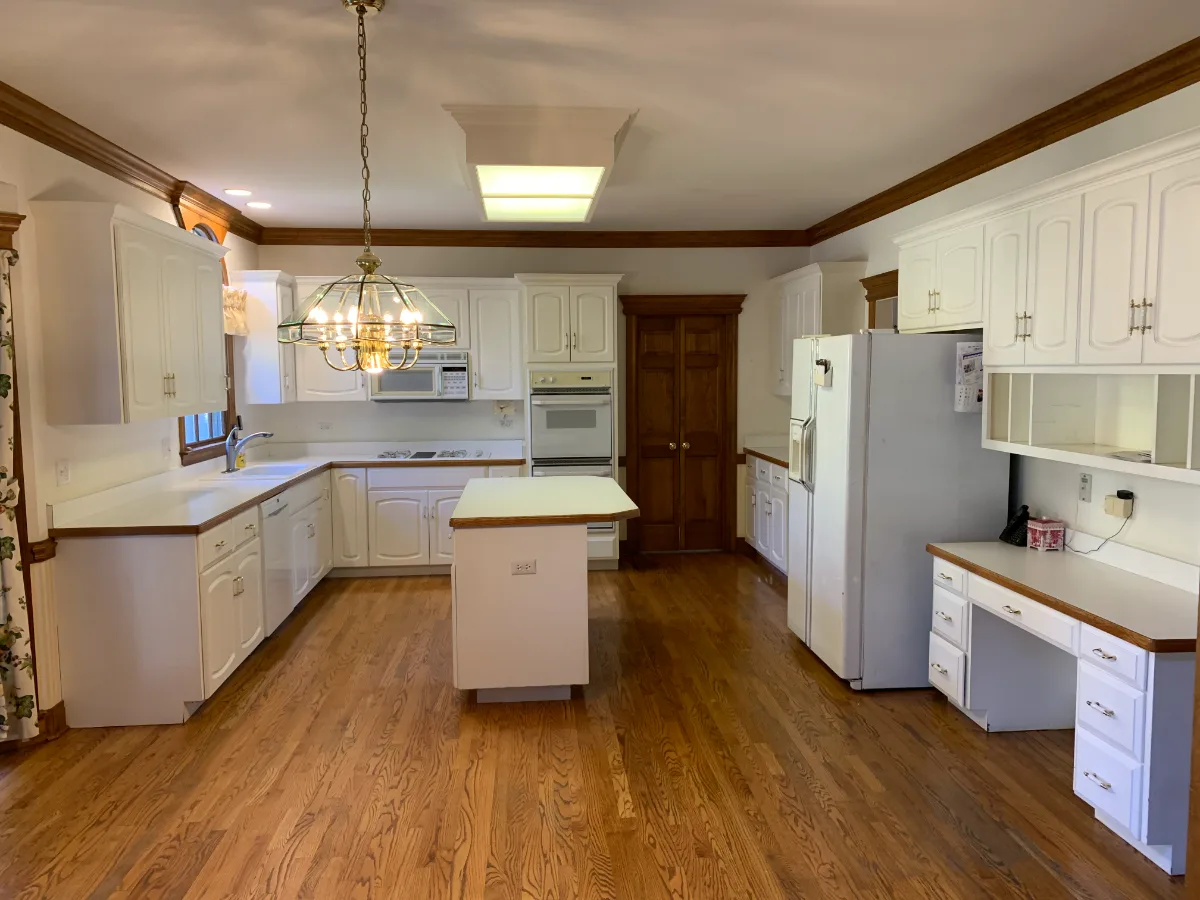 A transitional-refined kitchen in Franklin, TN. CWP Soft White and Tarragon Classic Square Recessed cabinetry, Cambria Ironsbridge Polished quartz, Delta Cassidy Polished Nickel faucet, and Sonoma Stellar Bossy Gray backsplash by Sebring Design.