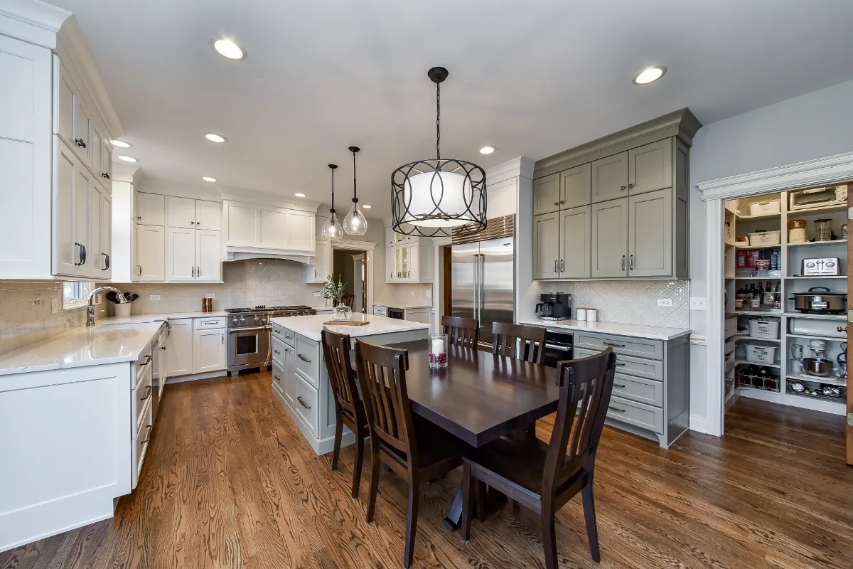 A refined-transitional kitchen remodel in Franklin, TN. CWP cabinetry in Soft White and Tarragon, Cambria Ironsbridge quartz, and Delta Cassidy Polished Nickel fixtures by Sebring Design Build.