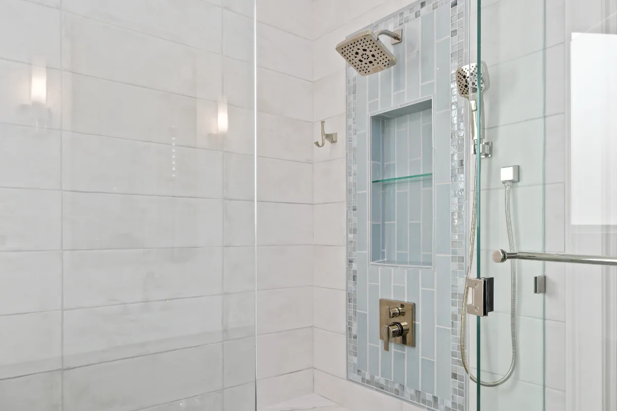 A modern-crisp-elegant primary bath in Westhaven, Franklin TN 37064. CWP Quartersawn White Oak Sage cabinetry, MetroQuartz Calacatta Gold, Brizo Virage Polished Nickel, MLW Sedona White walls, and Adex Habitat River Blue Glossy accent tile by.