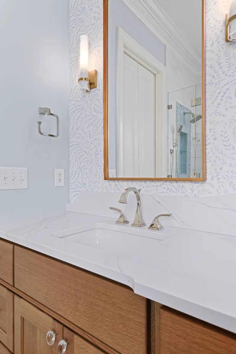 A modern-crisp-elegant primary bath in Westhaven, Franklin TN 37064. CWP Quartersawn White Oak Sage cabinetry, MetroQuartz Calacatta Gold, Brizo Virage Polished Nickel, MLW Sedona White walls, and Adex Habitat River Blue Glossy accent tile by.