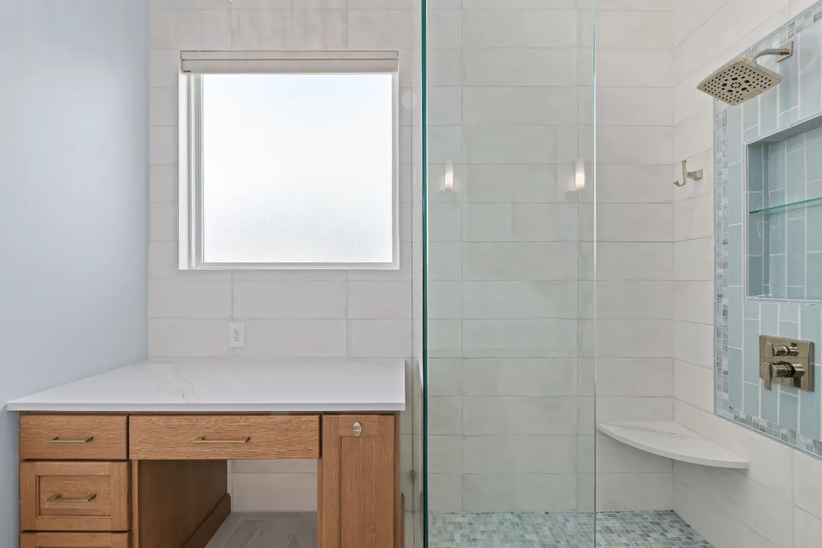 A modern-crisp-elegant primary bath in Westhaven, Franklin TN 37064. CWP Quartersawn White Oak Sage cabinetry, MetroQuartz Calacatta Gold, Brizo Virage Polished Nickel, MLW Sedona White walls, and Adex Habitat River Blue Glossy accent tile by.