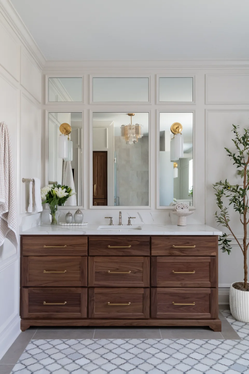 An elegant-classic primary bath in Willowsprings, Franklin TN 37064. CWP Walnut Natural Solid Wood Panel cabinetry, Mikado Calacatta Gold quartz, full Brizo Invari Polished Nickel fixture program, Gallery Pearl shower walls, and Empyrean Ice Blend.Primary