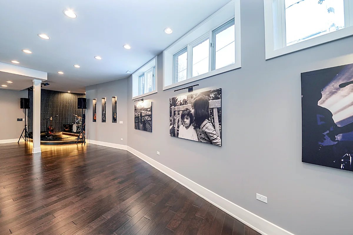 A modern-masculine finished basement in Brentwood, TN with a bar, guest bath, and stage by Sebring Design Build. Specs pending photo verification.