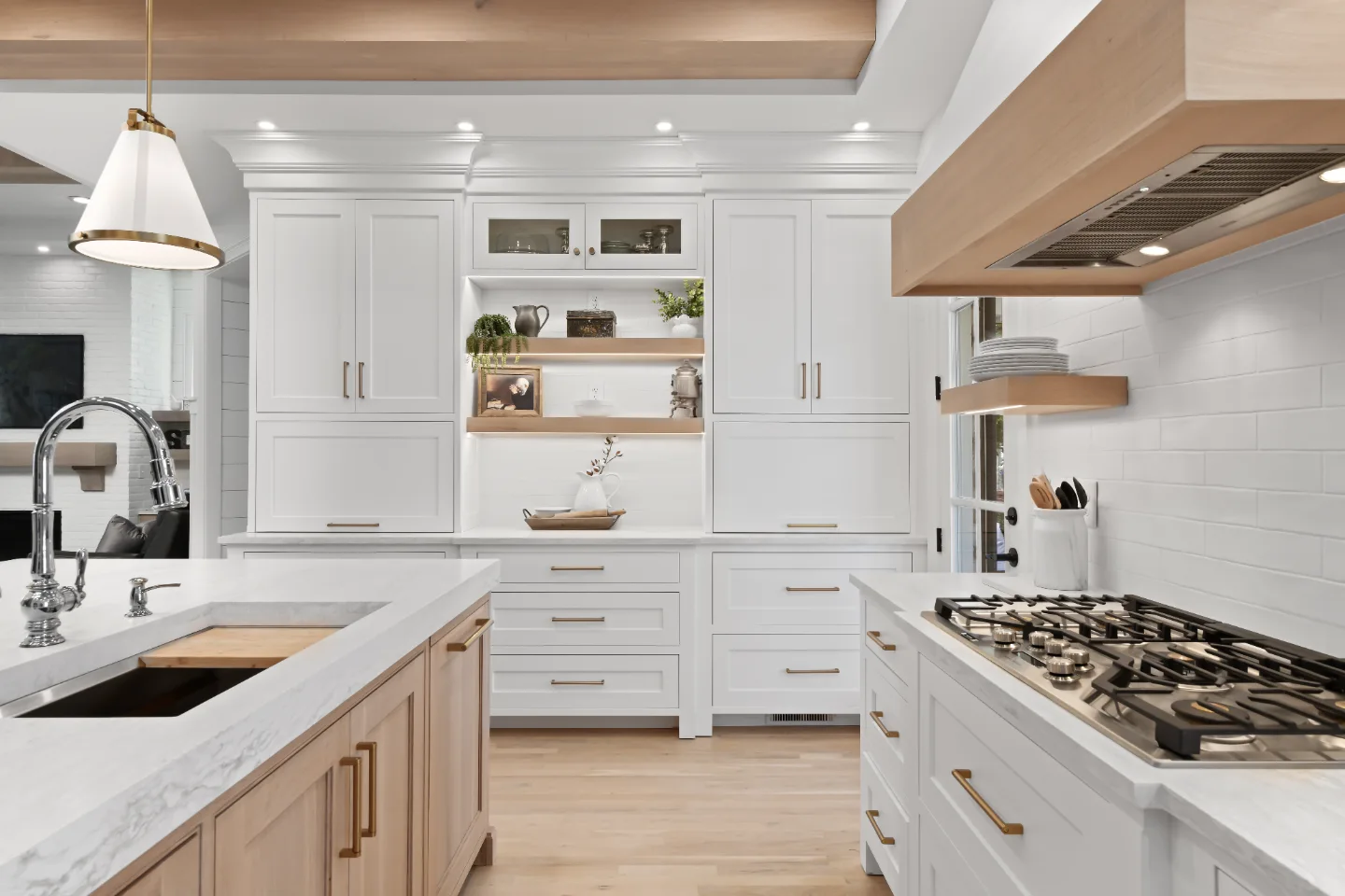A modern-farmhouse kitchen in Westhaven, Franklin TN 37064. CWP Bright White, Quartersawn White Oak Champagne, and Alder Sage cabinetry; Cambria Ironsbridge Matte quartz; Kohler Artifacts Satin Nickel; DalTile Linea Ghiaccio backsplash by Sebring.