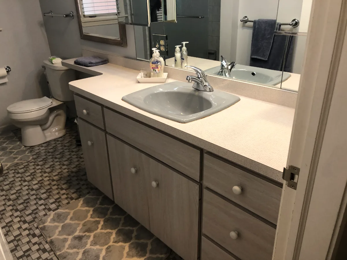 A retro-glamorous guest bath in Brentwood, TN. CWP Pearl Havana Square Recessed cabinetry, Hanstone Yorkville quartz, Moen Weymouth Brushed Gold, Caesar Ceramics Clash Essence Matte floor, and Statuario Venato polished marble-look shower tile by.