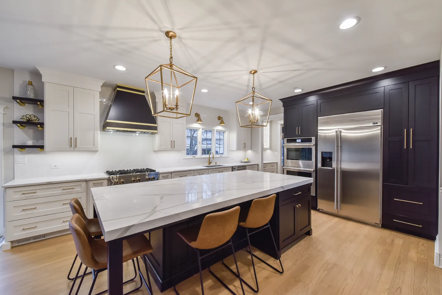 A modern-elegant dining room in Brentwood, TN, part of a whole-home remodel. Noir-and-gold material continuity from the kitchen by Sebring Design Build. Specs pending photo verification.