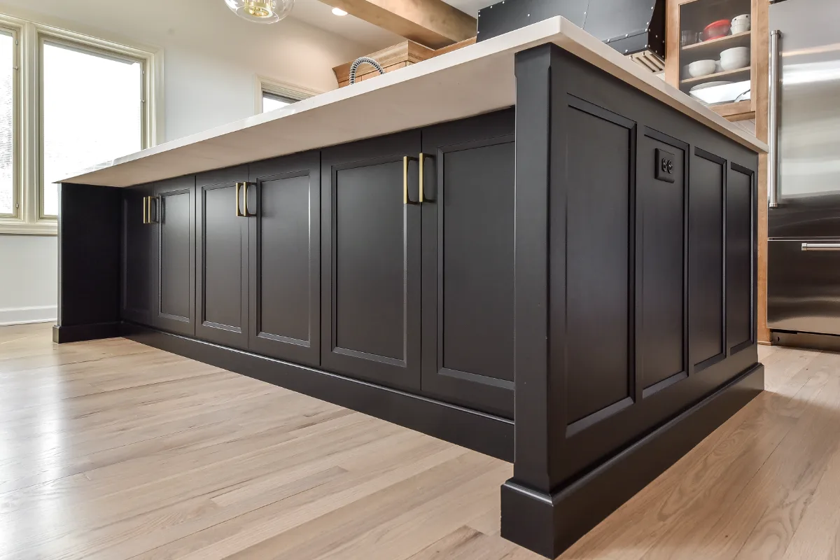 A modern-rustic kitchen in Brentwood, TN. CWP Fruitwood on Birch and Bunker Hill Black cabinetry, Cambria Charlestown Matte and Colton Polished quartz, Kohler Tournant faucet, and Ledger Stone Carbon backsplash by Sebring Design Build.