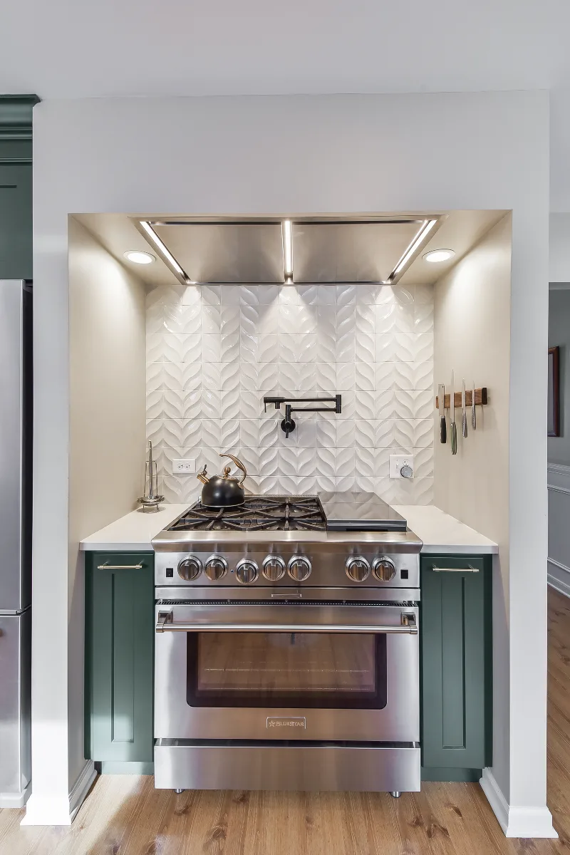 Kitchen remodel in Franklin, TN. Sebring Design Build transformed this Franklin, Tennessee galley kitchen with CWP Craftsman Square Recessed cabinetry in Soft White and Black Forest, Orion Calacatta Aria polished quartz.