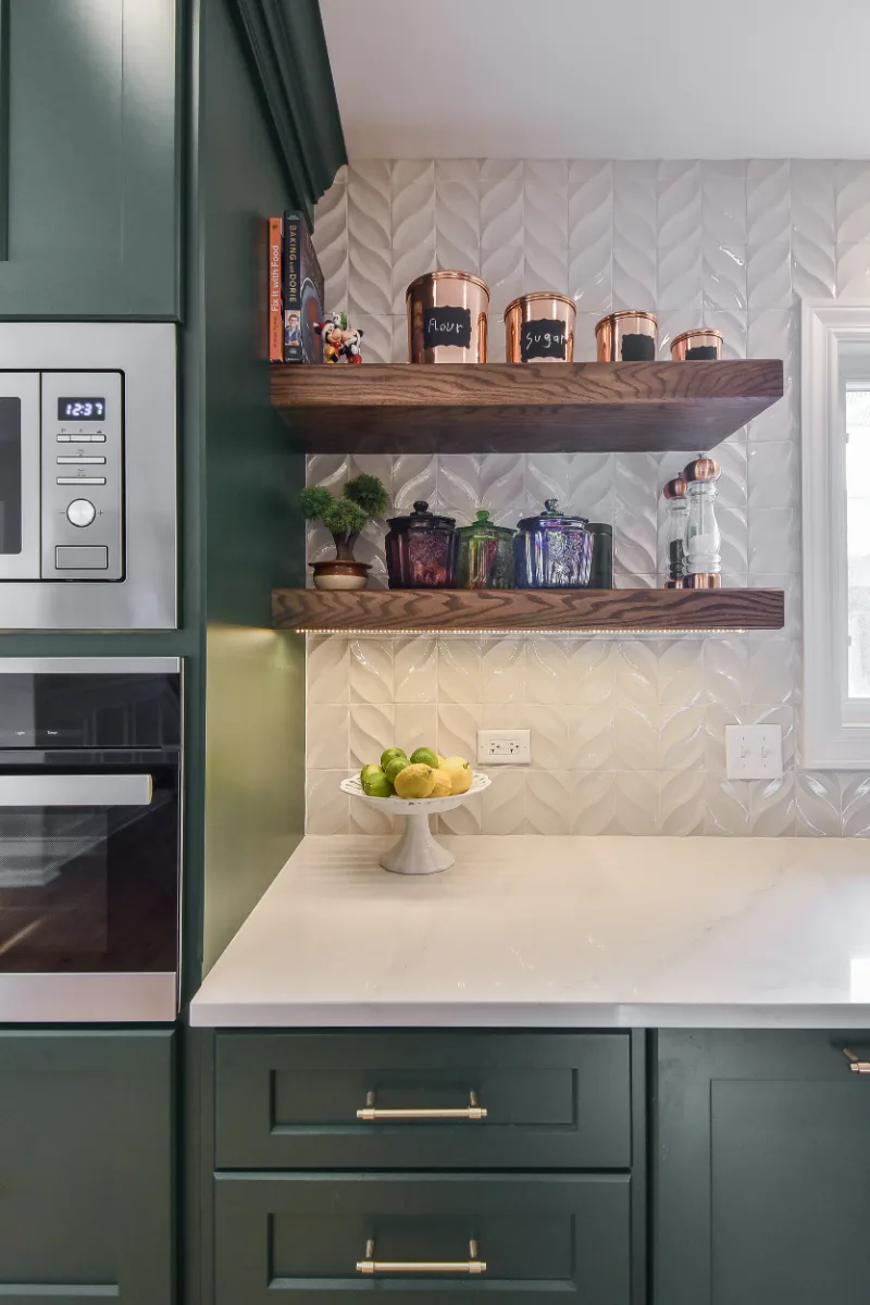 Kitchen remodel in Franklin, TN. Sebring Design Build transformed this Franklin, Tennessee galley kitchen with CWP Craftsman Square Recessed cabinetry in Soft White and Black Forest, Orion Calacatta Aria polished quartz.