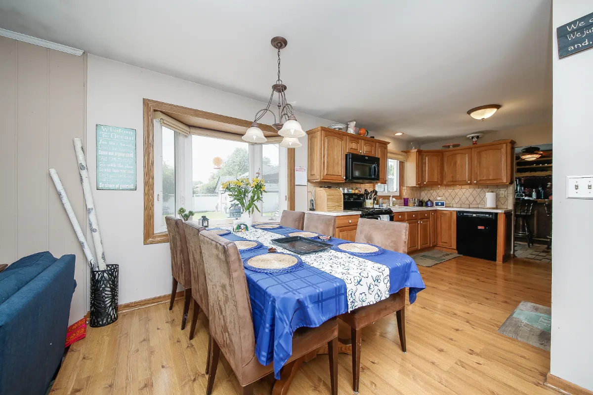 A bold-green dining room in Franklin, TN connected to a full kitchen remodel. Warm bronze and green palette continuity by Sebring Design Build. Specs pending photo verification.
