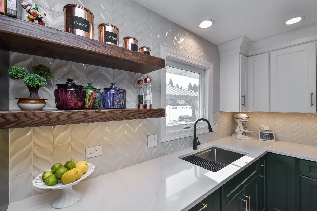 Kitchen remodel in Franklin, TN. Sebring Design Build transformed this Franklin, Tennessee galley kitchen with CWP Craftsman Square Recessed cabinetry in Soft White and Black Forest, Orion Calacatta Aria polished quartz.