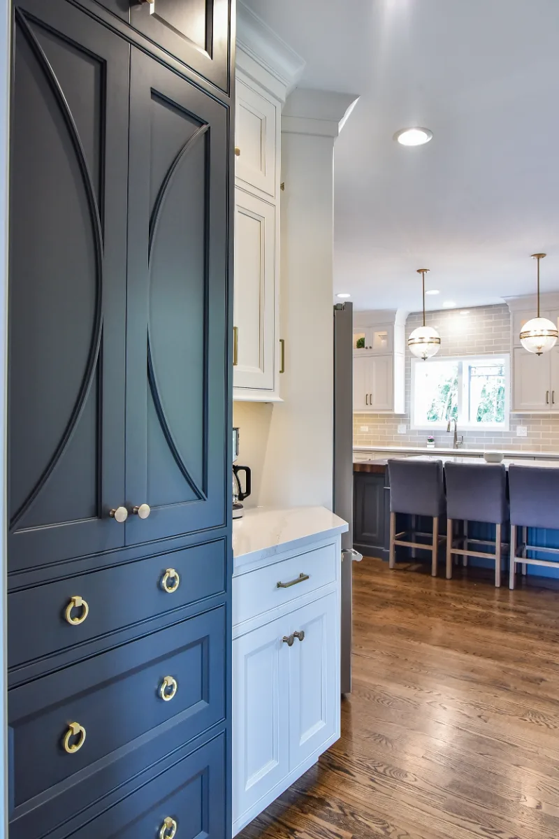 A transitional-warm kitchen in Brentwood, TN. CWP Snowbound and Urban Bronze Beaded Inset cabinetry, Orion Calacatta Aria quartz, Black Walnut end-grain island top, and Sonoma Stellar Metro Gray backsplash by Sebring Design Build.