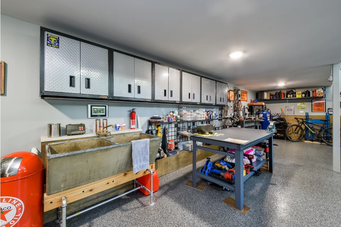 A rustic-organic custom garage in Franklin, TN with lift systems and classic car storage by Sebring Design Build. Specs pending photo verification.