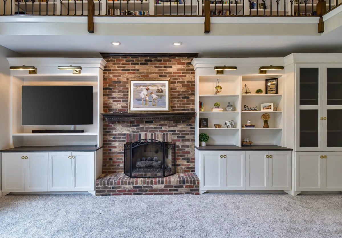 A transitional-warm living room in Brentwood, TN connected to a full kitchen remodel. Dark Walnut stained hardwood floors and warm material continuity by Sebring Design Build.